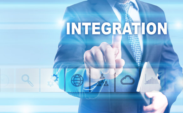 Businessman is pressing button on touch screen interface and selecting "Integration".