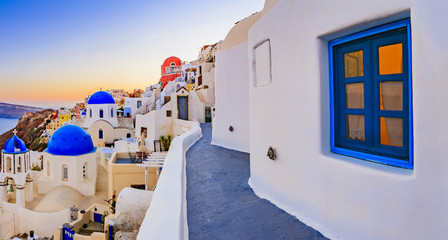 Oia town on Santorini island in Greece. Panoramic view of traditional and famous white houses and...