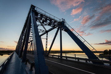 railway bridge with metal rails near river