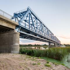 railway bridge with metal rails near river