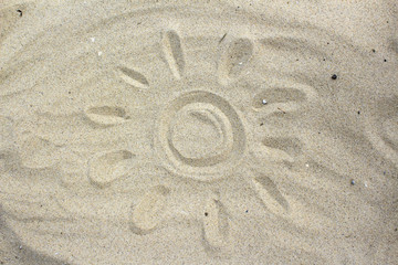 Sun drawing in the sand