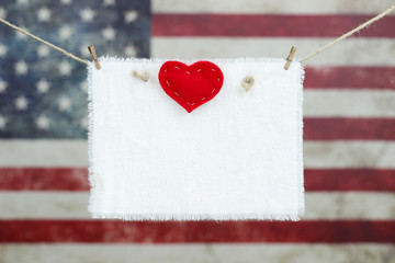 Blank sign with heart with American flag background