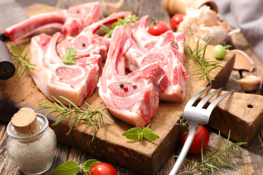raw lamb chop with rosemary and garlic