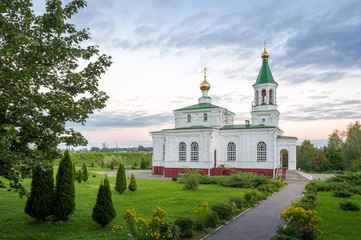 Fototapeta na wymiar Pokrovskaya old church and garden landscape in Polotsk, Belarus