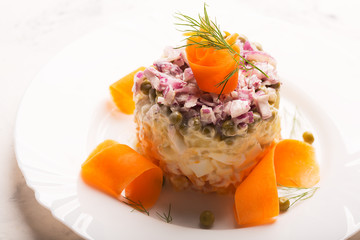 Traditional Russian salad olivie with boiled vegetables