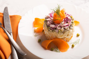 Traditional Russian salad olivie with boiled vegetables