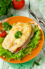 Pork chop with tomatoes, potatoes and cheese