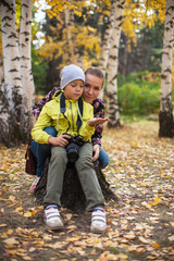 Woman and her son with camera