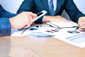 Fototapeta premium business colleagues working together and analyzing financial fig