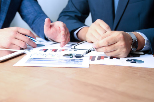 business colleagues working together and analyzing financial fig