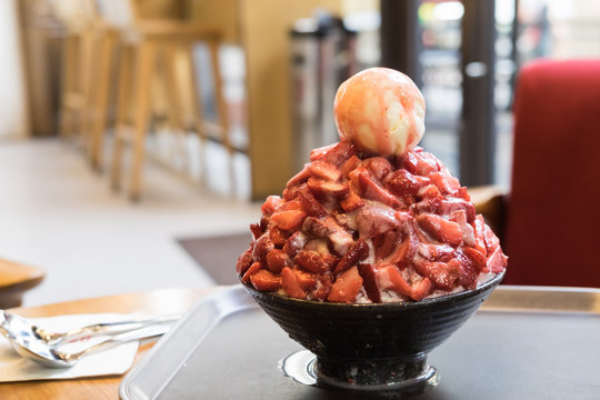Strawberry bingsu or bingsoo korean dessert or iced shaved with