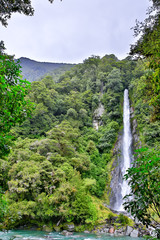Waterfall in the forest in Westland National Park, New Zealand