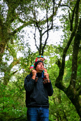 Father with little daughter on his shoulders looking up at the Waterfall,  Westland National Park, New Zealand