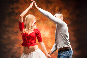 Young couple dances Caribbean Salsa