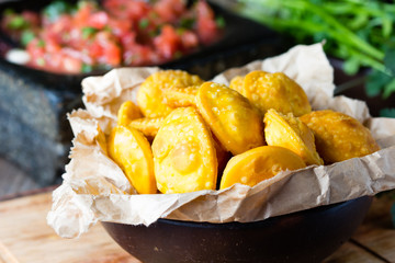 Latin American food. Traditional chilenian homemade pumpkin sopaipillas with salsa