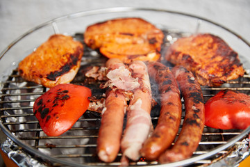 Barbecue grill with meat and sausages