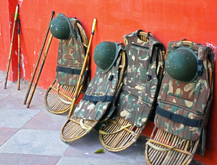 Indian Police shields, sticks and helmets laying on the ground