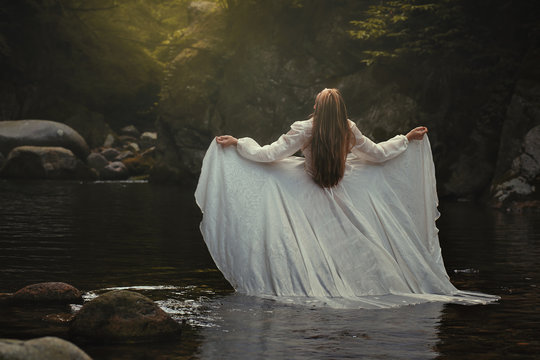 Woman in dreamy river