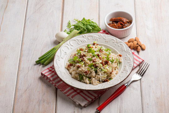 risotto with arugula dried tomatoes and almond
