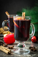 Christmas mulled wine and Christmas decoration on wooden table

