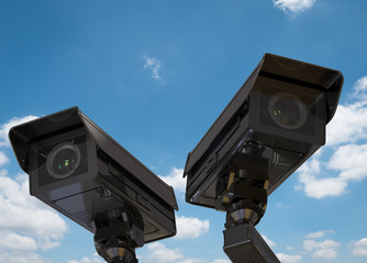 cctv camera or security camera on blue sky background
