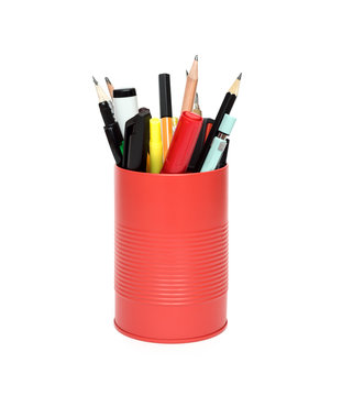 Red office pot with pencils and pens on a white background