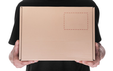Delivery man holding a cardbox.