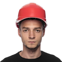 Young man in a construction helmet.