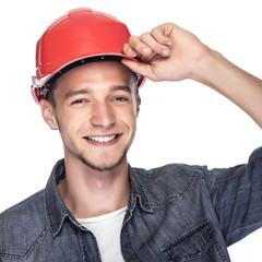 Young man in a construction helmet.
