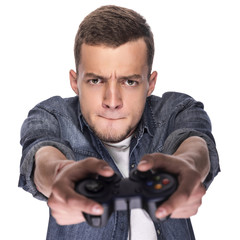 Young man playing on console or computer.
