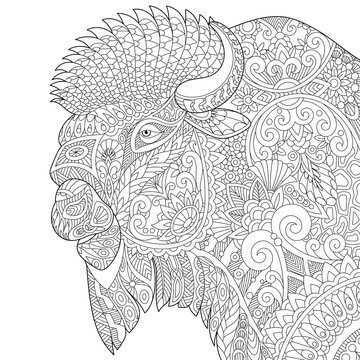 Stylized buffalo (american bison, bull, ox, yak, aurochs), isolated on white background. Freehand sketch for adult anti stress coloring book page with doodle and zentangle elements.