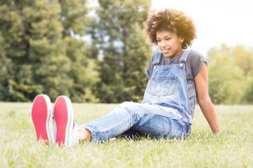 Fototapeta premium Young african american girl posing outdoor.