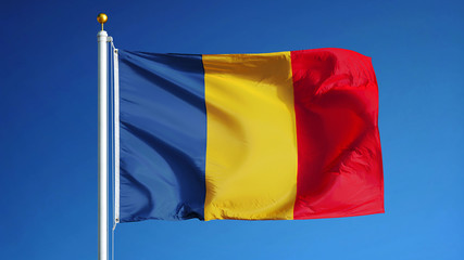 Chad flag waving against clean blue sky, close up, isolated with clipping path mask alpha channel transparency