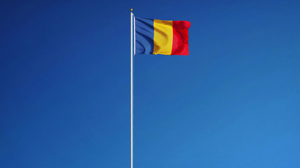 Chad flag waving against clean blue sky, long shot, isolated with clipping path mask alpha channel transparency