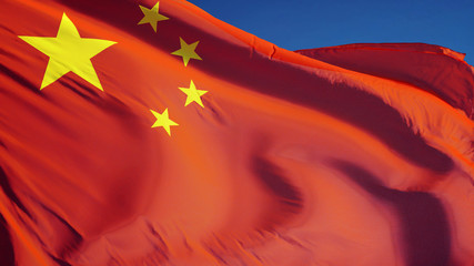 China flag waving against clean blue sky, close up, isolated with clipping path mask alpha channel...