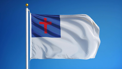 Christian flag waving against clean blue sky, close up, isolated with clipping path mask alpha...