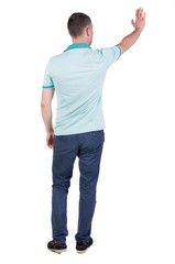 Fototapeta premium Back side view of man in shirt handshake. Isolated over white background. 