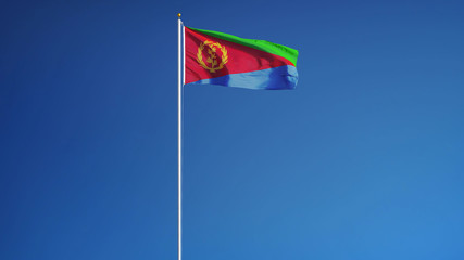 Eritrea flag waving against clean blue sky, close up, isolated with clipping path mask alpha channel transparency