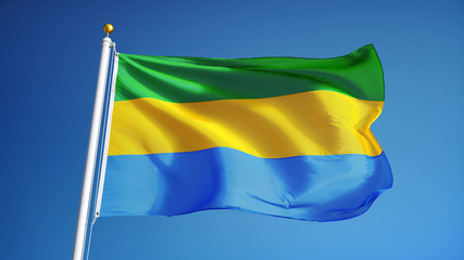 Gabon flag waving against clean blue sky, close up, isolated with clipping path mask alpha channel transparency