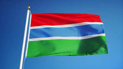 The Gambia flag waving against clean blue sky, close up, isolated with clipping path mask alpha channel transparency