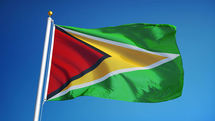Guyana flag waving against clean blue sky, close up, isolated with clipping path mask alpha channel transparency