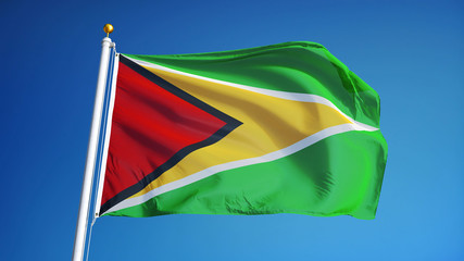 Guyana flag waving against clean blue sky, close up, isolated with clipping path mask alpha channel transparency
