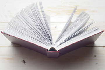 Open book on light table. Back to school. Copy space.