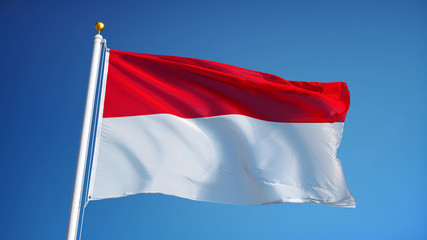 Fototapeta na wymiar Indonesia flag waving against clean blue sky, close up, isolated with clipping path mask alpha channel transparency