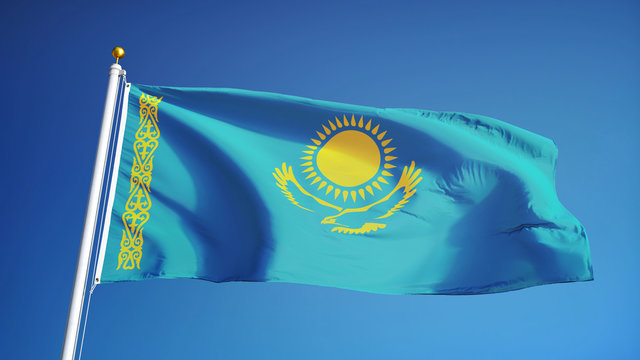 Kazakhstan flag waving against clean blue sky, close up, isolated with clipping path mask alpha channel transparency