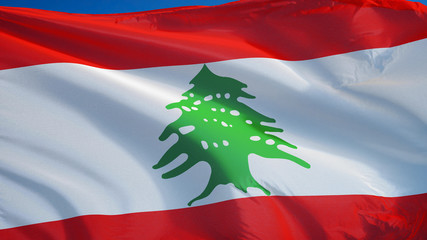 Lebanon flag waving against clean blue sky, close up, isolated with clipping path mask alpha channel transparency