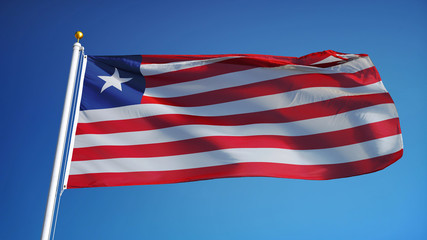 Liberia flag waving against clean blue sky, close up, isolated with clipping path mask alpha channel transparency