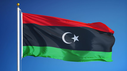 Libya flag waving against clean blue sky, close up, isolated with clipping path mask alpha channel transparency