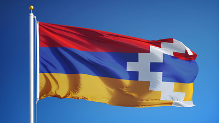 Nagorno-Karabakh flag waving against clean blue sky, close up, isolated with clipping path mask alpha channel transparency