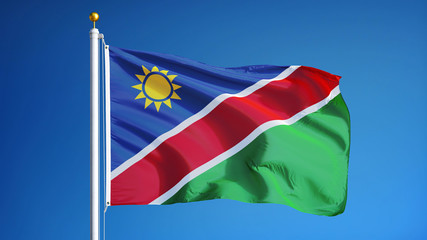Obraz premium Namibia flag waving against clean blue sky, close up, isolated with clipping path mask alpha channel transparency